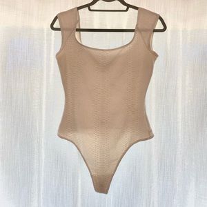 Ona white snake skin bodysuit. Size Medium. Like new!